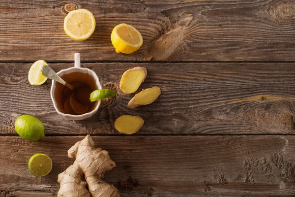 Ginger tea with lime in a white cup — Stock Photo, Image