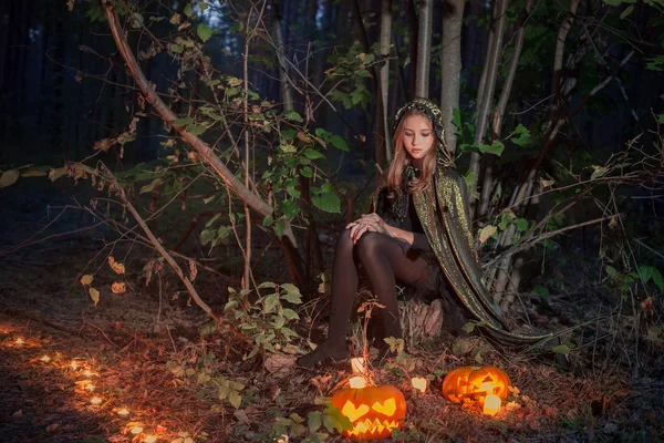 Beautiful witch in forest — Stock Photo, Image