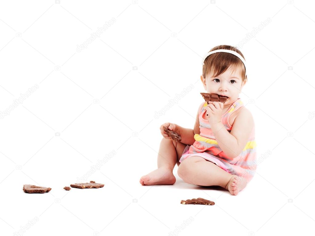 little girl with chocolate isolated on white