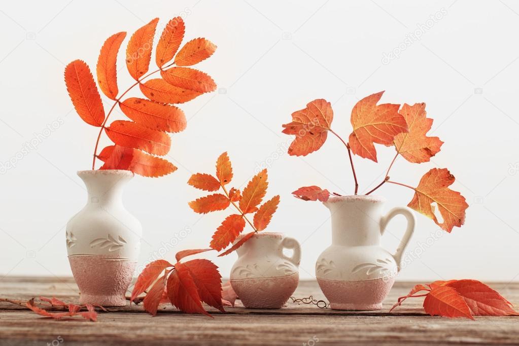 Autumn Leaves over wooden background