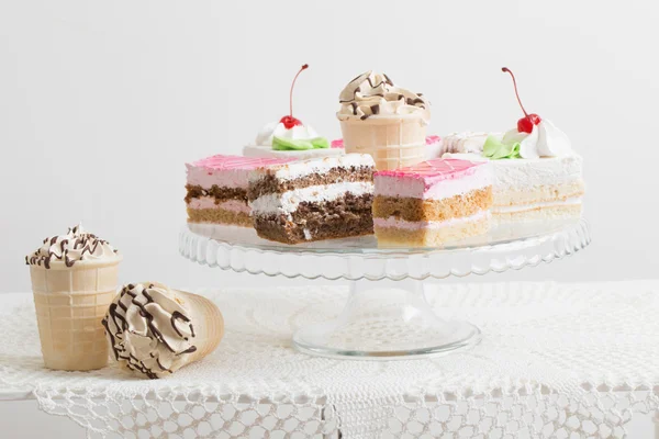 Cakes on white table — Stock Photo, Image