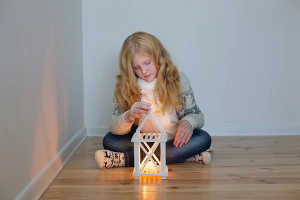 Girl with Christmas lantern indoor — Stock Photo, Image