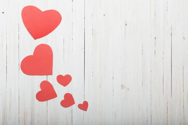 Red hearts on old wooden background — Stock Photo, Image