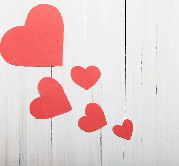 Red hearts on old wooden background — Stock Photo, Image