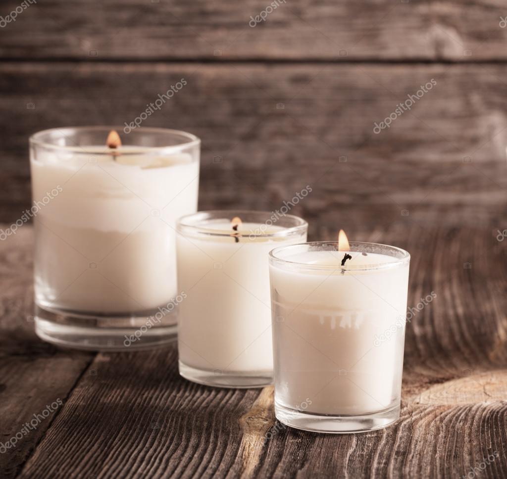 Scented candles on old wooden background — Stock Photo © Kruchenkova