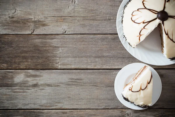 Cake on wooden table background — Stock Photo, Image