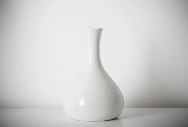 White vase on white shelf — Stock Photo, Image