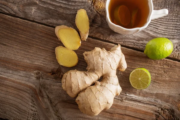 Ginger tea with lime in a white cup — Stock Photo, Image