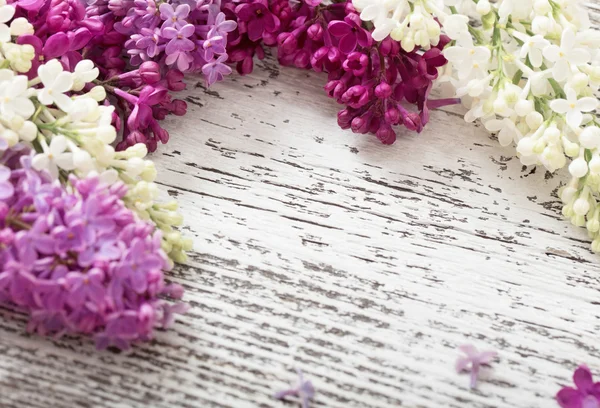 The beautiful lilac on a wooden background — Stock Photo, Image