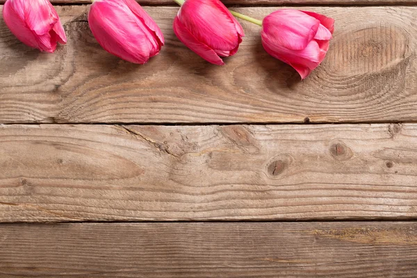 Beautiful tulips on wooden background — Stock Photo, Image