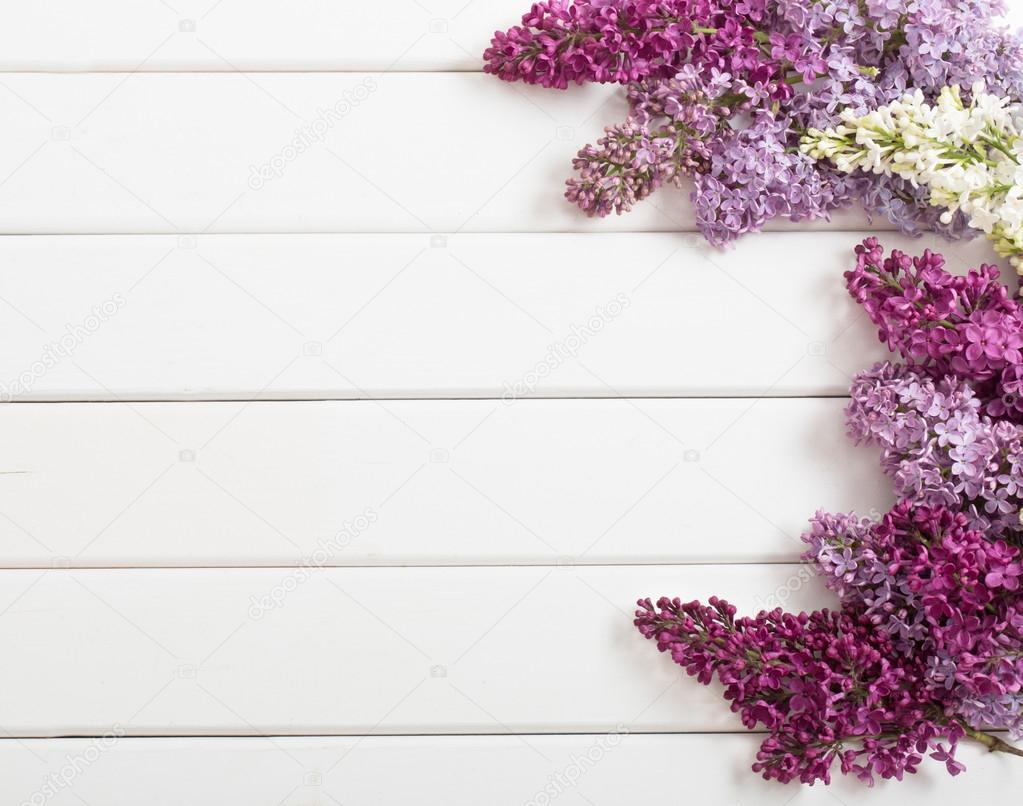 The beautiful lilac on a wooden background