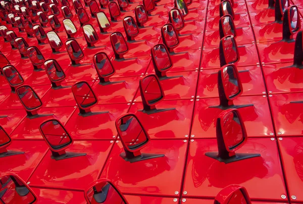 Red background in the form of automobile mirrors — Stock Photo, Image