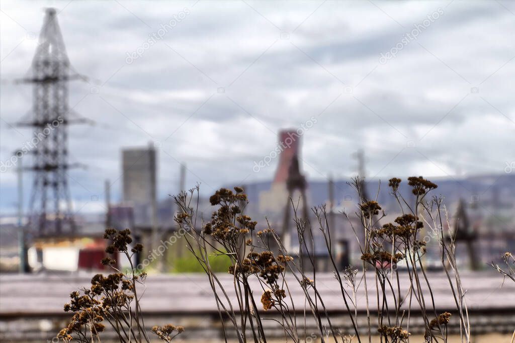 Bad ecology. Uncomfortable cities of polar region. High-rise buildings around the plant, dumps. Permanent rainy weather. HDR foto
