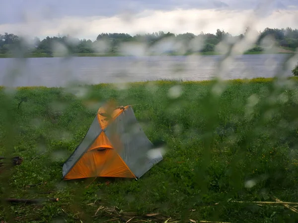 Rainy rainy day. Drops poured glass window. Comfort in warmth of home and tent of a lone camper 1