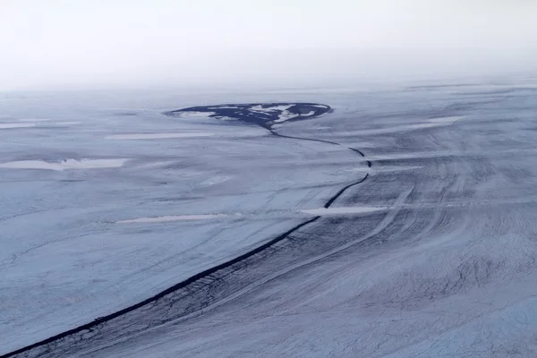 Arctic glacier and the stone river in it — Stock Photo, Image