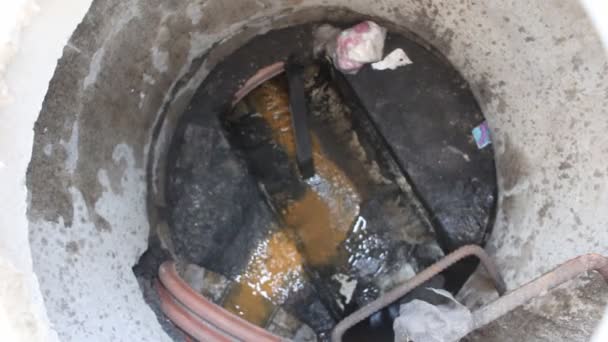 Under sewer manhole on  pavement on  street — Stock Video