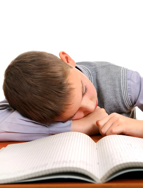 Уставший школьник спит — стоковое фото