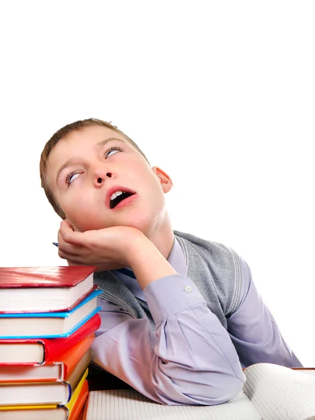 Enfant ennuyé avec les livres — Photo