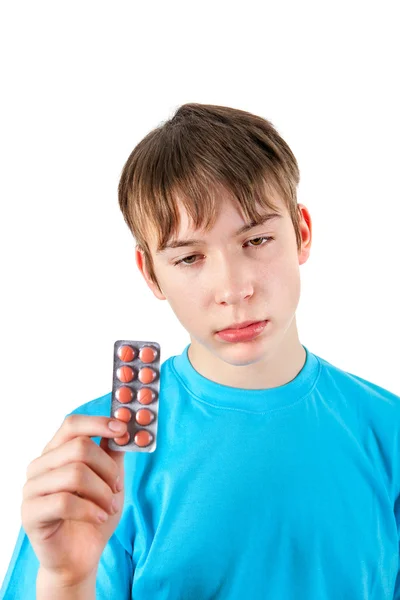 Niño con las píldoras — Foto de Stock