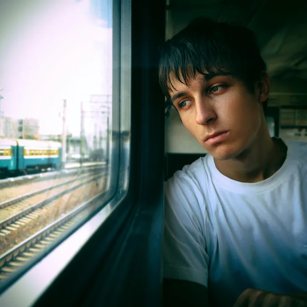 Triste adolescente pela janela — Fotografia de Stock