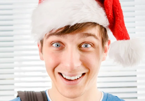 Happy Young Man Santa Hat Jalousie Background Closeup — Stock Photo, Image