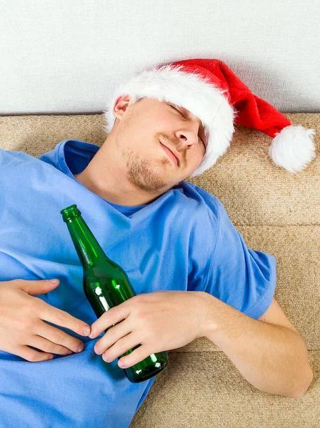 Young Man Santa Hat Sleeping Sofa Beer — Stock Photo, Image