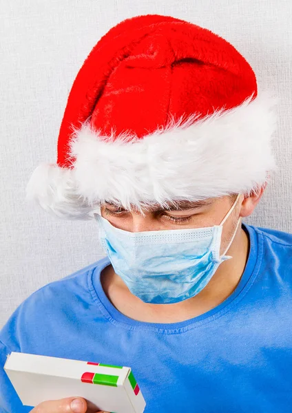 Young Man Santa Hat Flu Mask Hold Pills Pack — Stock Photo, Image