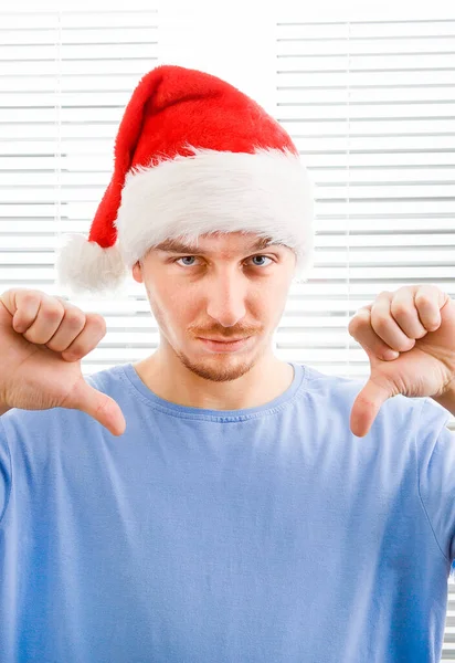 Joven Santa Sombrero Hacer Pulgar Hacia Abajo Fondo Jalousie — Foto de Stock