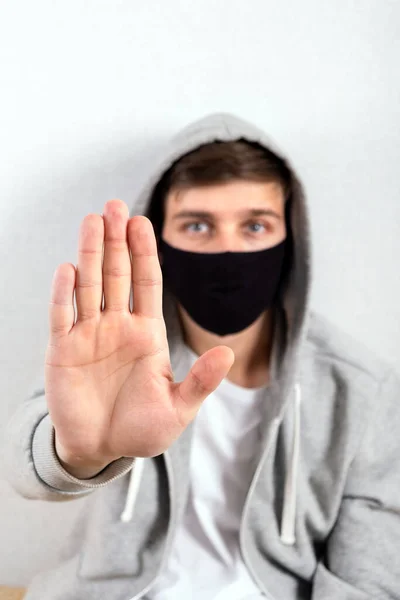 Young Man Flu Mask Show Stop Gesture Wall Room — Stock Photo, Image