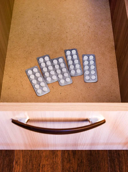 Pills Packs in the Drawer of the Furniture