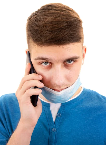 Fiatal Férfi Influenza Maszk Egy Mobiltelefon Fehér Háttér Közelkép — Stock Fotó