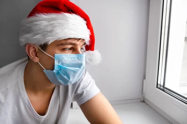 Pensive Young Man Santa Hat Window — Stock Photo, Image