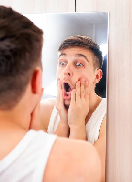 Surprised Young Man Looking Reflection Mirror Room — Stock Photo, Image