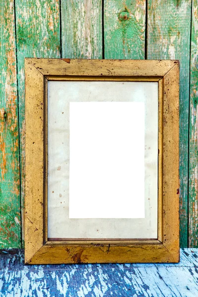 Old Wooden Frame with Empty Paper on the Weathered Paint Planks Background