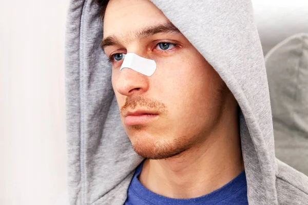 Sad Young Man Sticking Plaster Nose Portrait Closeup — Stock Photo, Image