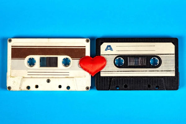 Two Old Audio Cassettes Red Heart Blue Paper Background Closeup — Stock Photo, Image