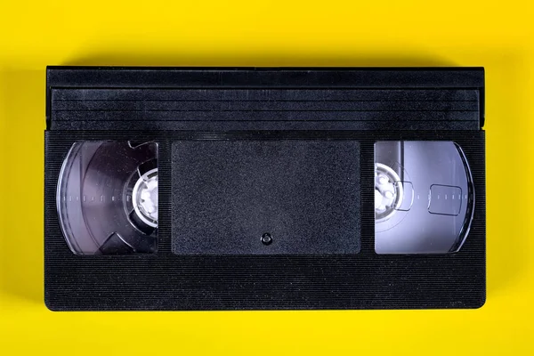 Retro Videoband Cassette Een Achtergrond Van Geel Papier — Stockfoto