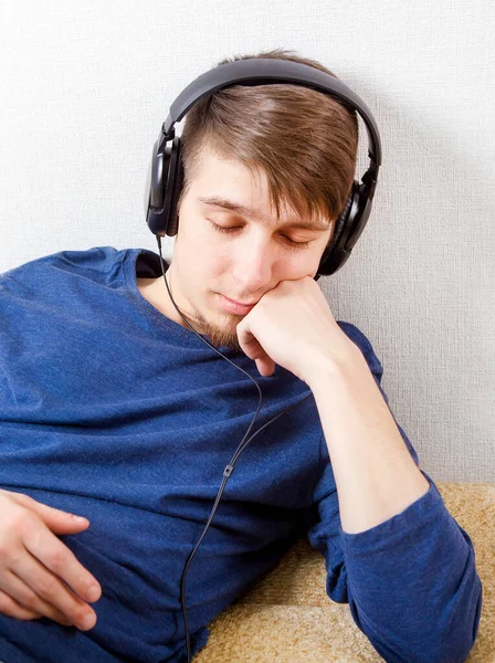 Sleepy Young Man Headphones Wall — Stok fotoğraf