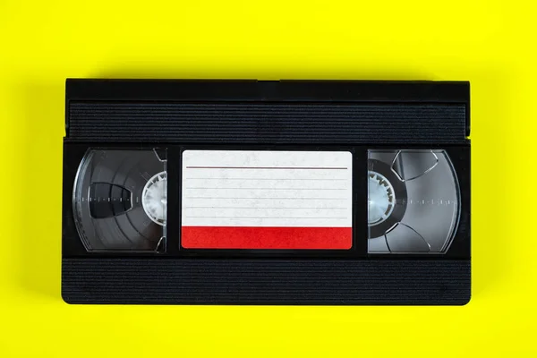 Retro Video Tape Cassette Yellow Paper Background — Stock Photo, Image