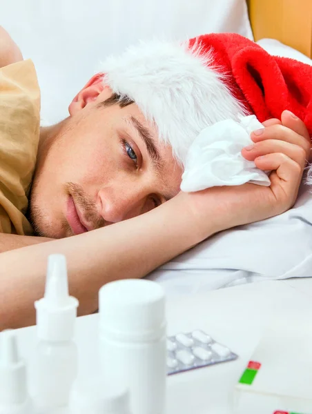 Jovem Doente Santa Chapéu Cama Casa — Fotografia de Stock