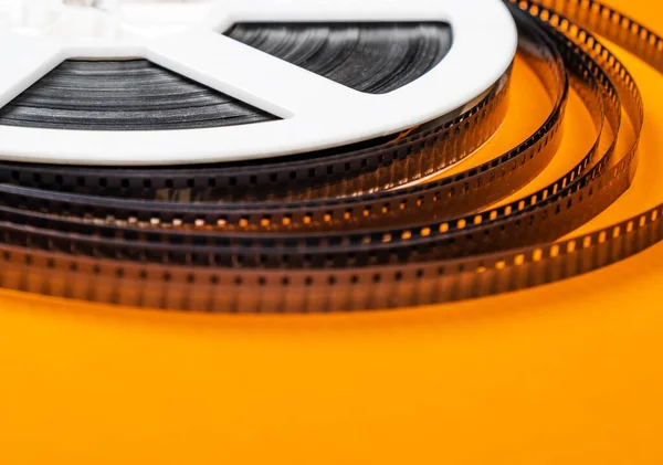 Old Film Reel Orange Background Closeup — Stock Photo, Image