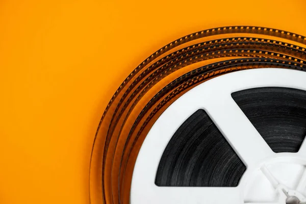 Old Film Reel Orange Background Closeup — Stock Photo, Image