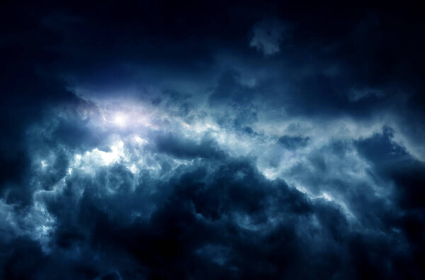 Light in the Dark and Dramatic Storm Clouds