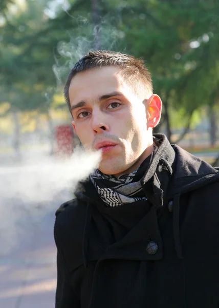 Man smoking outdoor — Stock Photo, Image