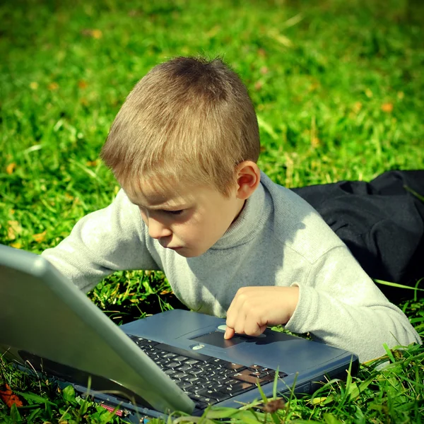 Kid with Laptop Royalty Free Stock Images