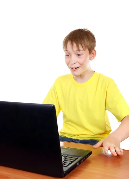 Niño con portátil — Foto de Stock