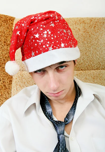 Zmęczony nastolatek w Santa Hat — Zdjęcie stockowe