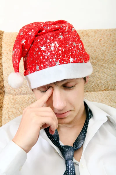 Κουρασμένος έφηβος στο Santa καπέλο — Φωτογραφία Αρχείου