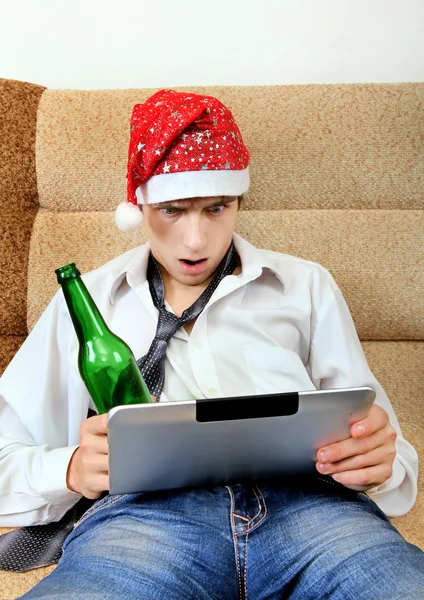 Teenager with a Beer and Tablet — Stock Photo, Image