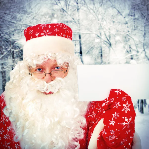 Papai Noel com papel branco — Fotografia de Stock